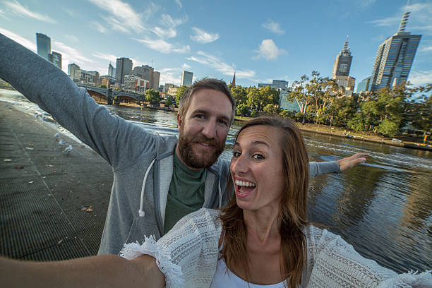 istock Couple take selfie portrait with Melbourne skyline on background 509361168