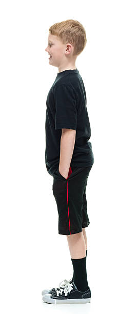 istock Smiling little boy standing and looking away 509361886