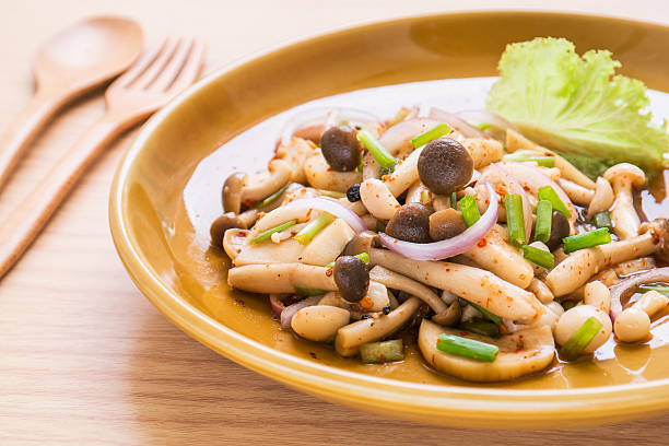 istock Spicy mushroom salad on plate, Thai food style 509362947