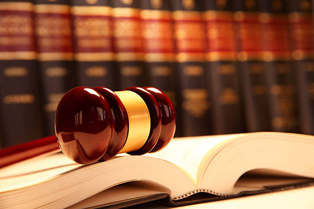 istock Gavel Resting On Top Of Open Law Book 509364546