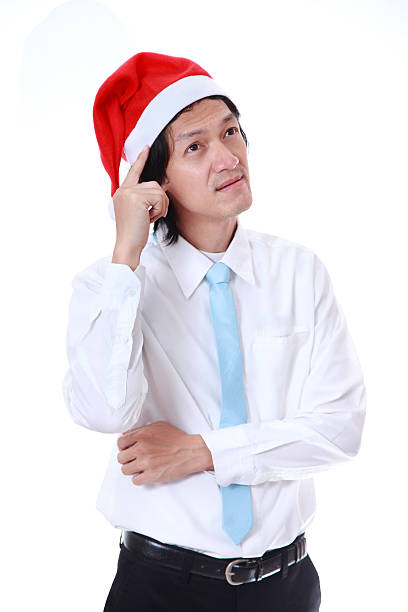 istock Young man wearing a Santa's hat on white background. 509365539