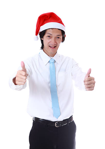 istock Young man wearing a Santa's hat and smiling. 509365553