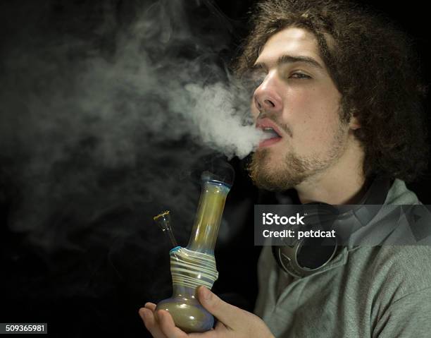Getting High Smoking A Bong Stock Photo - Download Image Now - Bong, Smoking - Activity, Marijuana - Herbal Cannabis