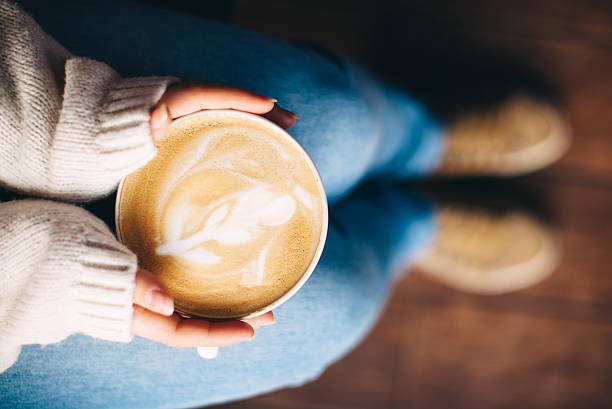 istock Girl's hands holding a cup of coffee 509366152