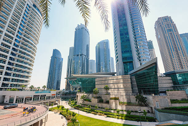 Jumeirah Lakes Towers district. Dubai, United Arab Emirates - March 28, 2014: Buildings view of Jumeirah Lakes Towers district.  jumeirah stock pictures, royalty-free photos & images