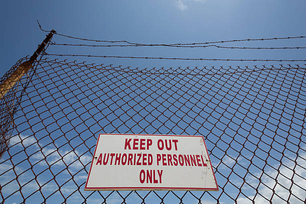 istock Keep Out sign on the fence with barb wire 509368805