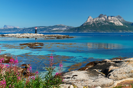 Panoramic view of Vestfjorden and Lofotens islands through coastal lighthouse from Tranoy , Norway.