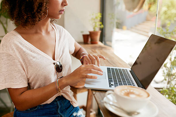 istock Young woman working on laptop in cafe 509373520
