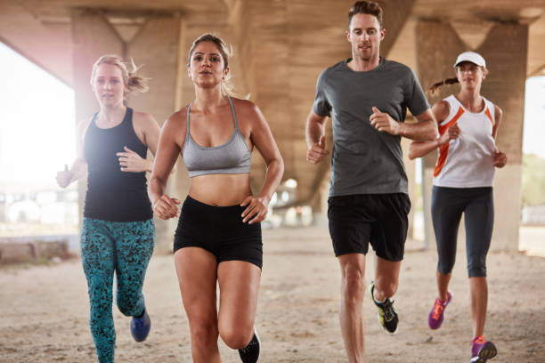 istock Healthy young people running together 509373790
