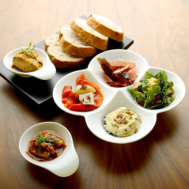 istock Mixed food on white and black plate with ham 509388541