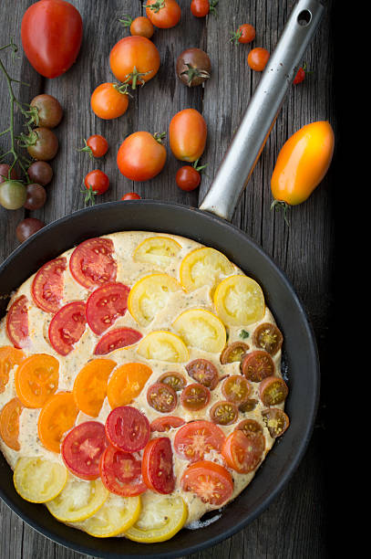 istock Omelet with vegetables and cheese. Frittata in a frying pan 509390355