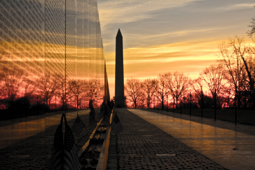 Washington, D.C. USA - January 31, 2014: The Washington Monument and Vietnam Memorial Wall at Sunrise