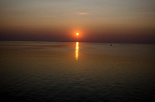istock sunrise over the water 509392603