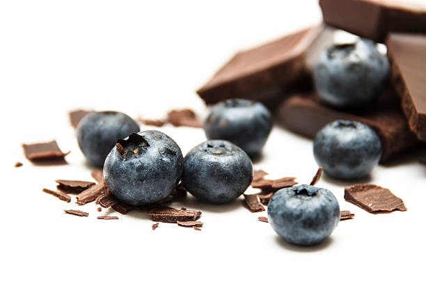 Blueberries with chocolate isolated on white background stock photo