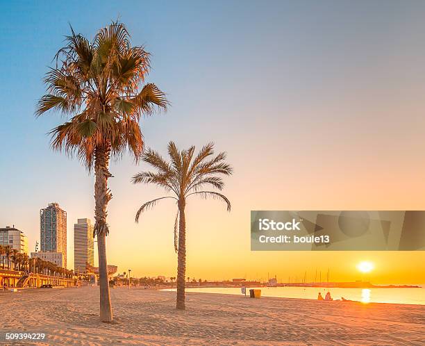 Barceloneta Beach In Barcelona At Sunrise Stock Photo - Download Image Now - Beach, Barceloneta Beach, Sand