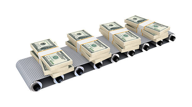 Dollar packs on grey conveyor. stock photo