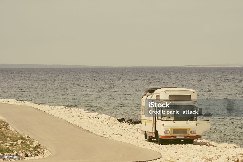 Retro van by the sea on the old photo style Retro van by the sea on the old vintage photo filter Retro Style Stock Photo