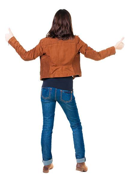 istock Back view of  woman thumbs up. 509395565
