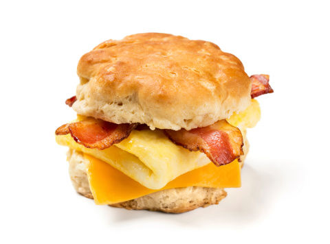 Bacon, egg, and cheese biscuit on white background.  Please see my portfolio for other food and drink images.