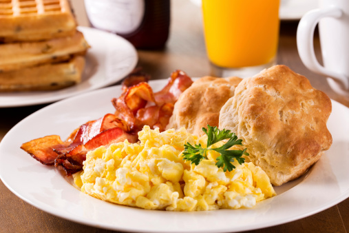 Breakfast - Scrambled eggs, bacon, buttermilk biscuits, waffles with juice and coffee.  Please see my portfolio for other food and drink images.