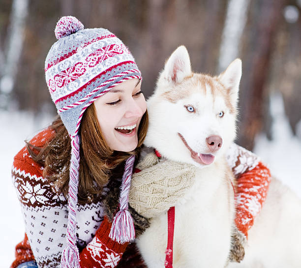 istock Young woman with dog winter outdoors fun 509408758