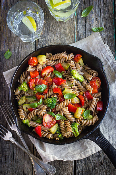 istock Whole wheat fusilli pasta  with vegetables 509408954