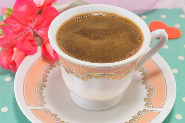 istock Vintage cup of coffee and  flowers 509409200