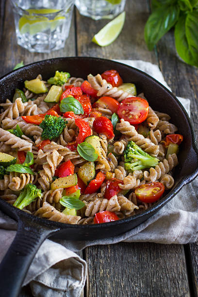 istock Whole wheat fusilli pasta  with vegetables 509409636