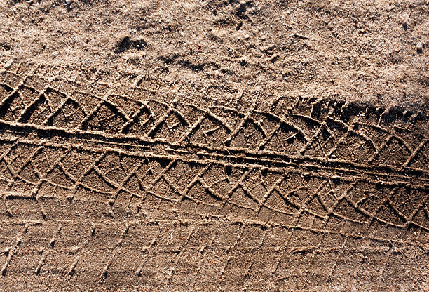 Car track on sand road.