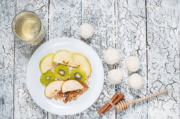 istock Oatmeal with apples, pears, walnuts and kiwi 509410444