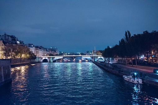 River Seine, Paris, night with red, white and blue reflections, the colours of the French flag