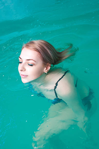 istock Young woman relaxing in the water 509412314