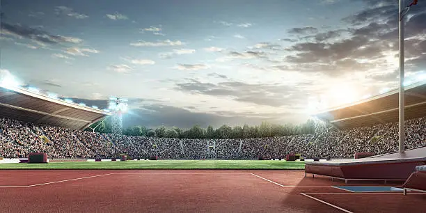 Outdoor floodlit stadium full of spectators under evening sky. Pole vaulting zone is on the foreground. Image made in 3D.
