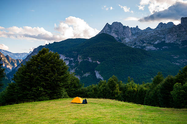 istock yellow tent camping under idyllic mountain sunrise 509413292