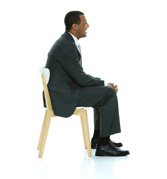 istock Smiling businessman sitting on chair 509413808