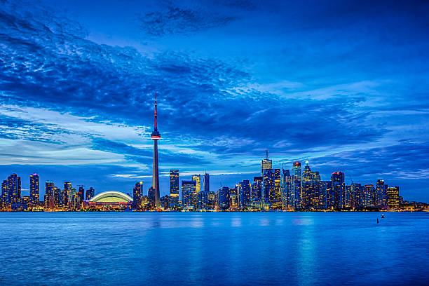 istock Toronto cityscape with CN Tower and baseball stadium at dusk 509417647
