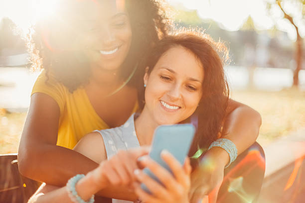 istock Mixed race women in the city texting 509418094