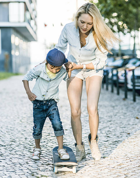 istock mom and son with skateboard 509419675
