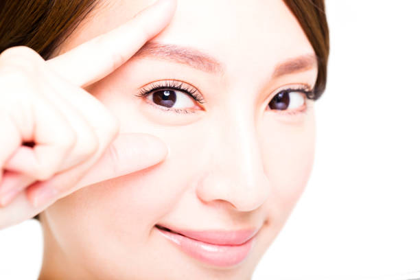 Closeup shot of young smiling woman eyes makeup Closeup shot of young smiling woman eyes makeup asian eyebrows stock pictures, royalty-free photos & images