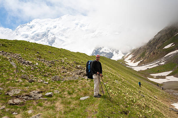 istock Hikier is climbing mountain in Caucasus mountains in Bezengi reg 509419962
