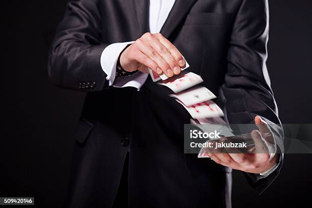 Young Magician Showing Tricks Using Cards From Deck Close Up Stock Photo - Download Image Now