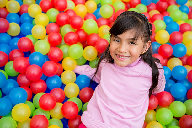 istock Girl playing at the ball pool 509421347