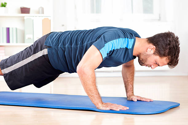 istock Side View of an Athletic Man Doing Push Ups 509421612