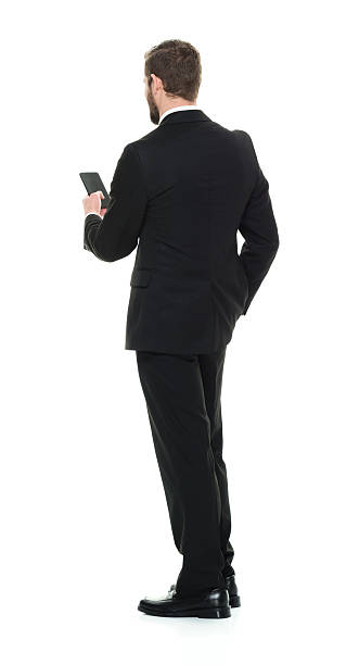 istock Rear view of businessman using phone 509422178