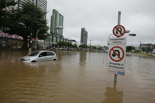 Salvador, Brazil - April 9, 2015: Vehicle is seen in flooding after a storm in the neighborhood of Pituba in Salvador (BA).