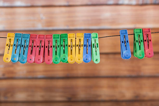 istock clothes-pins on a wooden background 509422981