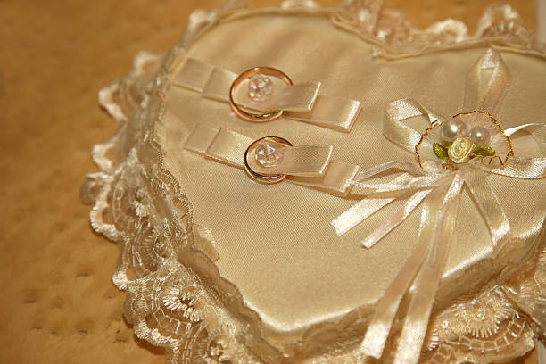 istock gold wedding rings lie on a decorative pillow 509423202