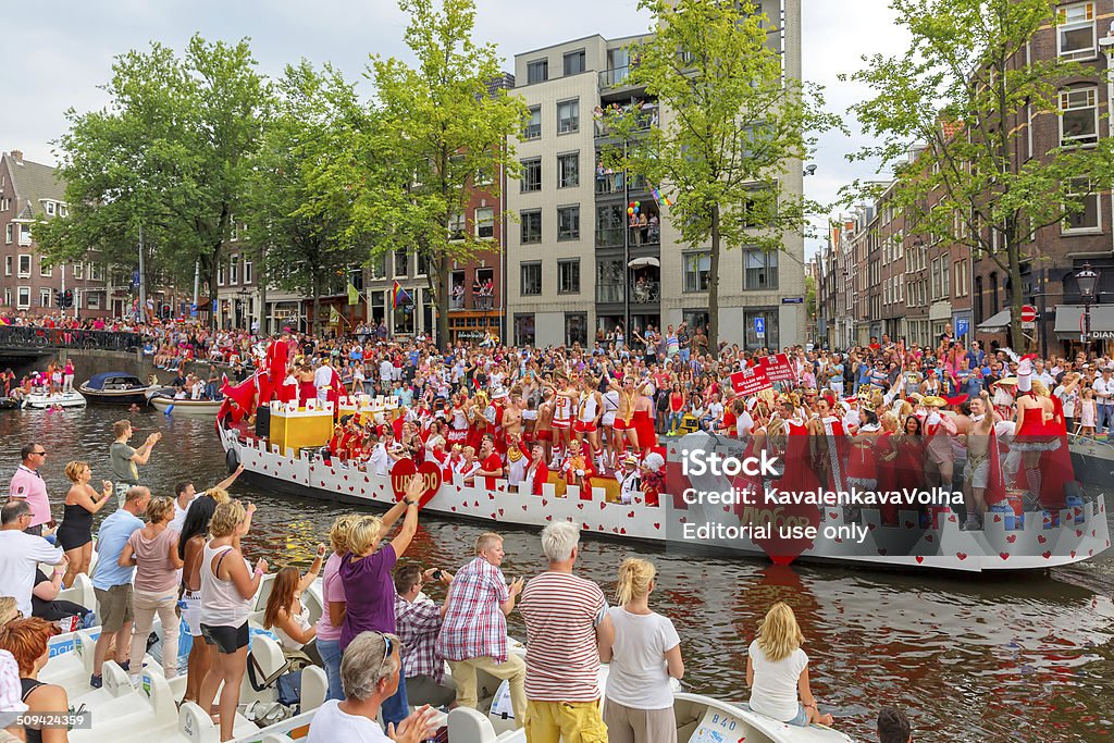 Amsterdam Canal Parade 2014 Amsterdam, Netherlands - August 2, 2014: Participants at the famous Canal Parade of the Amsterdam Gay Pride 2014 on the Prinsengracht canal in Amsterdam. The parade is one of the biggest public events in the Netherlands, every year it is visited by more than 400000 people. 2014 Stock Photo