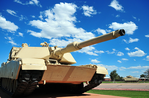 M1 Abrams tank, front-side view - main battle tank (unmarked, on static display outside Fort Carson Mountain Post, Colorado, USA)