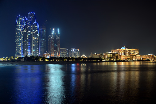 The futuristic towers of Marina Bay Sands illuminated at night, Singapore.